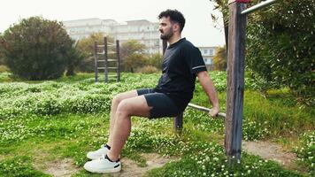 Man Working Out Surrounded By The Green Of The City Park video