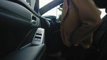 Concept of success embodiment demonstrating achievements and luxurious lifestyle. Business woman driving a new luxury car enjoying her expensive purchase. video