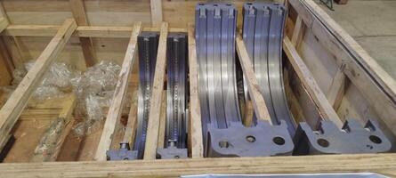 Turbine cylinder sleeve. PT 100. Turbine cylinder sleeve in a wooden crate. Metal industrial parts packaged. Precision-engineered components for machinery, ready for shipping and assembly. Shipping photo