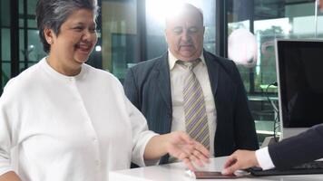 Check In, Business or traveler people checking in at an airport counter. video