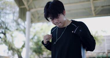 Selective focus shot, Stylish Asian man with dancing skills, moving body coolly and stylishly to the rhythm. Solo dance. video