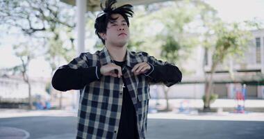 Handheld selective focus shot, Stylish man with dancing skills, moving body coolly and stylishly to the rhythm. Solo dance. video