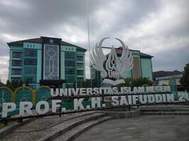 Banyumas, Indonesia, July 15, 2025, Front view of Universitas Islam Negeri Prof. K.H. Saifuddin Zuhri Purwokerto with its iconic logo, modern campus buildings photo