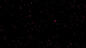 A black background with pink dots on it video