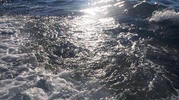 Huge sea wave and white foam, slow motion video
