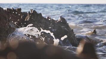 Stormy and turbulent sea hitting shore, slow motion video
