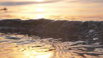 Seashore at sunrise and waves motion, tracking shot slow motion video