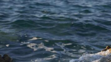 Huge splashing waves hitting shore, slow motion video