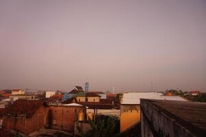 A view of a city from a rooftop photo