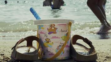 Play Bucket and Slippers near the Beach on Sand video