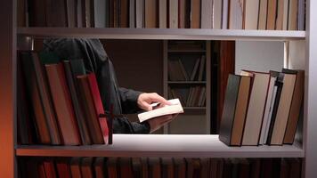Priest reading holy book in the library video