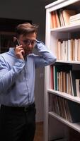A man in a bookcase video