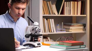 A man using a microscope video