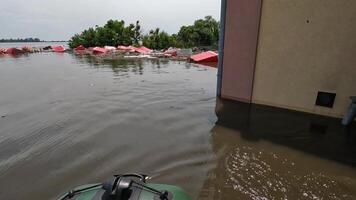 Male hand of volunteers rowing with an oar the boat after detonation of Hydroelectric Power Station. Flooding in Kherson as result of explosion of dam on Dnipro river in city of Novaya Kakhovka video