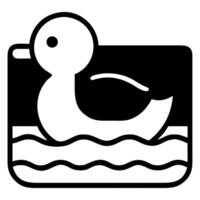 Simple black and white icon of a rubber duck floating in wavy water vector