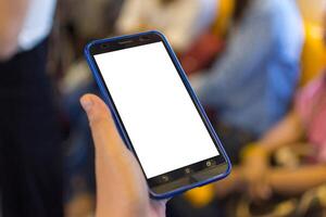 A person holding a smart phone with a blank screen photo