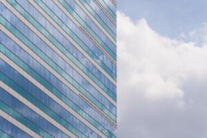 A blue building with a white sky photo