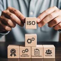 Building business excellence with iso standards and teamwork blocks photo