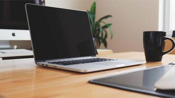 Silver laptop open on an office desk with a coffee, ideal for business and technology-focused communication and work photo