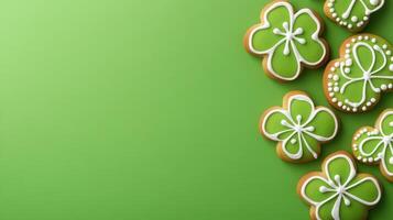 Green sugar cookies featuring intricate white icing patterns resting on matching emerald surface, highlighting festive saint patrick's day color palette photo