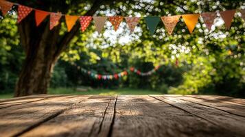 Wooden displaying top with colorful party flags hanging on trees in a garden, perfect for table products photo