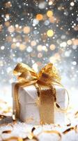 Gift box with golden ribbon and sparkles photo