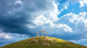Three wooden crosses stand on a grassy hill symbolizing faith, sacrifice, and redemption against a dramatic cloudy sky photo