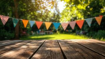 Wooden table top with colorful party flags hanging on trees in a garden, perfect for displaying products photo