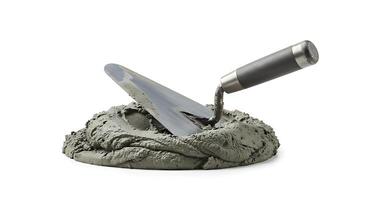 A shovel and cement in a mound photo