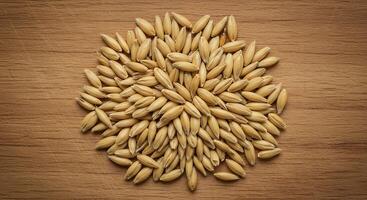 Wheat grains on a wooden table photo