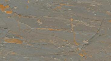 A close up of a stone wall with orange paint photo