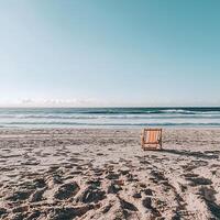 Tranquil Beach Scene A Single Chair on Sandy Shore. photo
