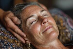 A woman getting a facial massage photo