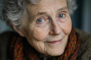 An older woman with blue eyes looking at the camera photo