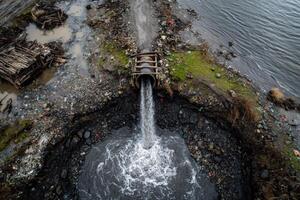 A water pipe is flowing into the water photo