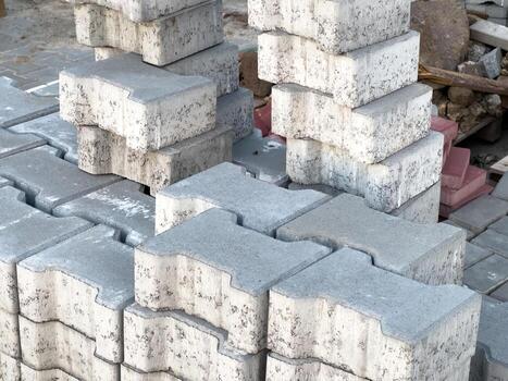 Sturdy concrete blocks are stacked neatly at a construction site, ready for use in various building projects during the day photo