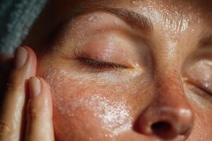 A woman with skin care products on her face photo
