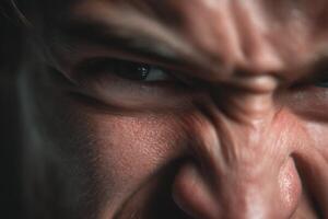 A close up of a man's face with a big angry look photo