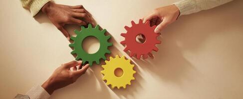 The gears of collaboration symbolize teamwork and innovative problem-solving in business. photo