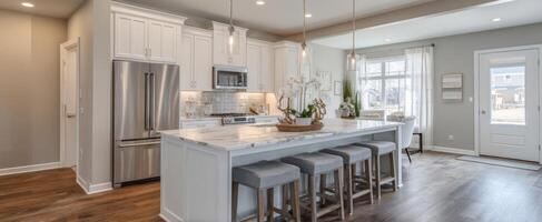 The modern kitchen featuring a spacious island and stylish decor elements. photo