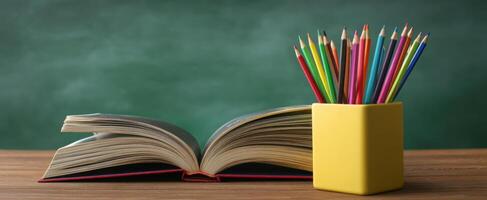 The open book and colorful pencils in a vibrant educational setting. photo