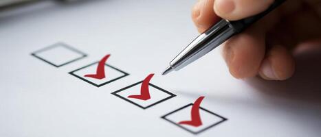 The pen marking checkboxes on a productivity checklist for task completion. photo
