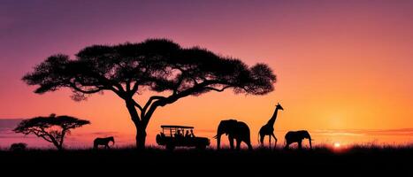 The majestic elephants and giraffes against a vibrant sunset silhouette. photo