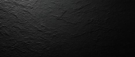 The textured black surface emphasizing minimalist elegance and modern design. photo
