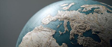 The detailed world globe showcasing European geography with metallic accents. photo
