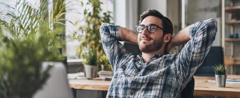 The relaxed man enjoying a moment of peace in a modern workspace. photo