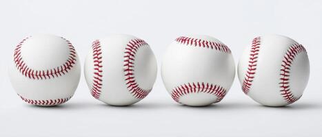 The baseballs arranged in a dynamic sequence showcasing their design and texture. photo