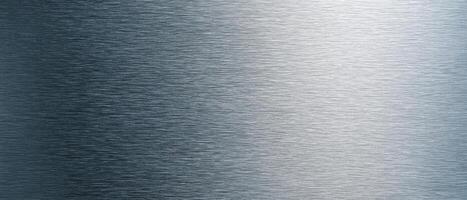 The brushed metal surface with sleek modern design and subtle reflections. photo