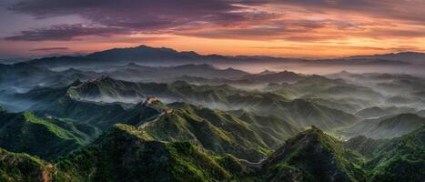 The Great Wall of China Overlooking Majestic Mountain Landscape at Sunset photo