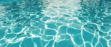 The tranquil surface of a shimmering blue swimming pool water. photo